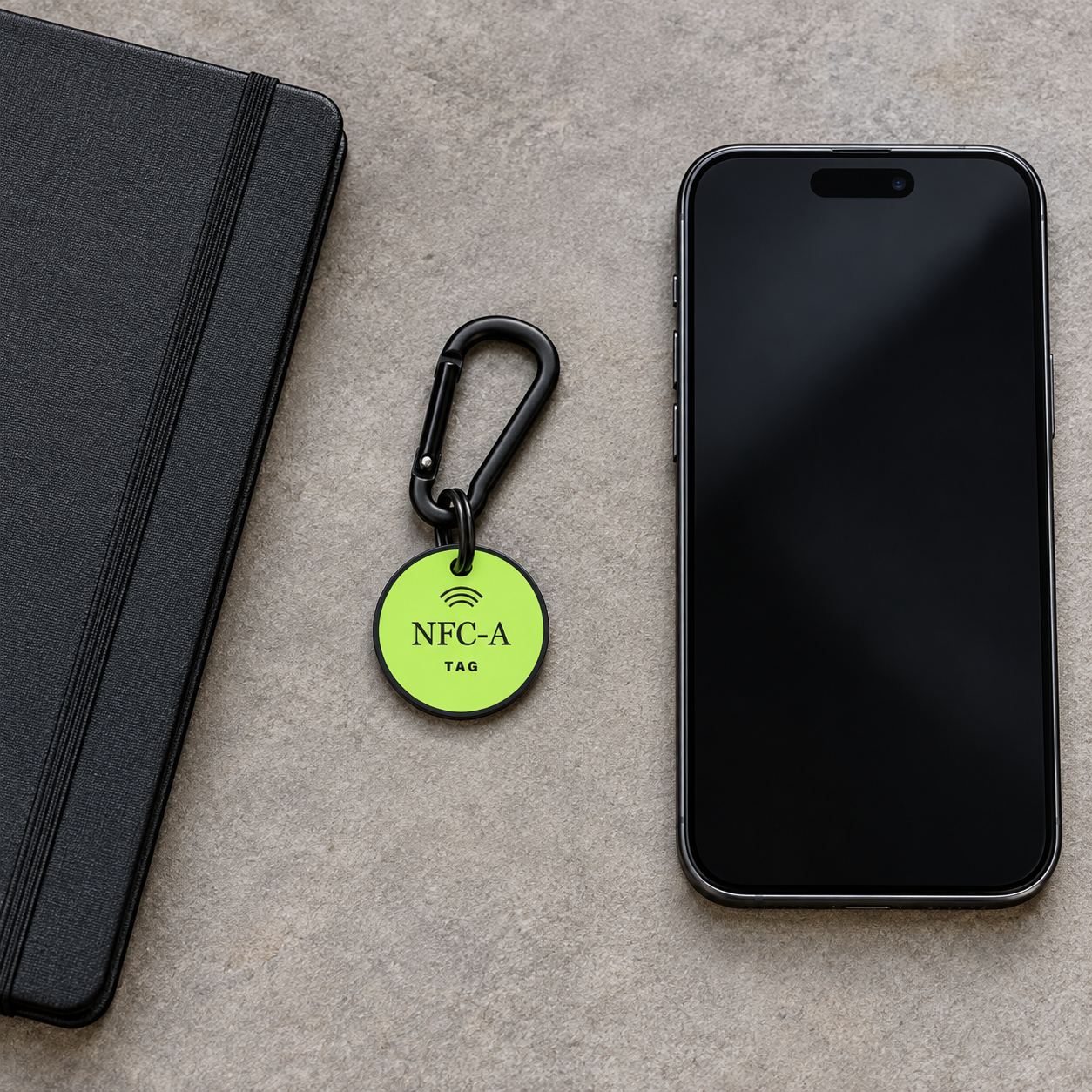 Top-down view of a phone and NFC-A TAG coin clipped to a meeting folio prepared for a program review.